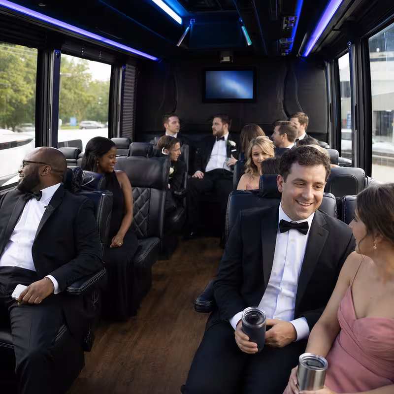 Wedding guests seated inside a Birmingham party bus