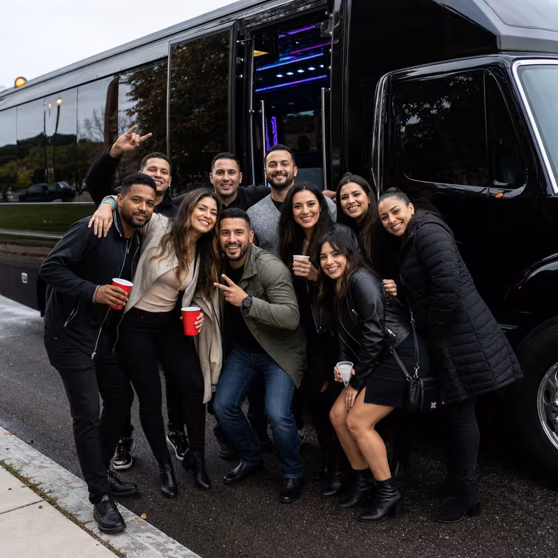 Party bus interior with wraparound leather seating and LED lighting in Birmingham