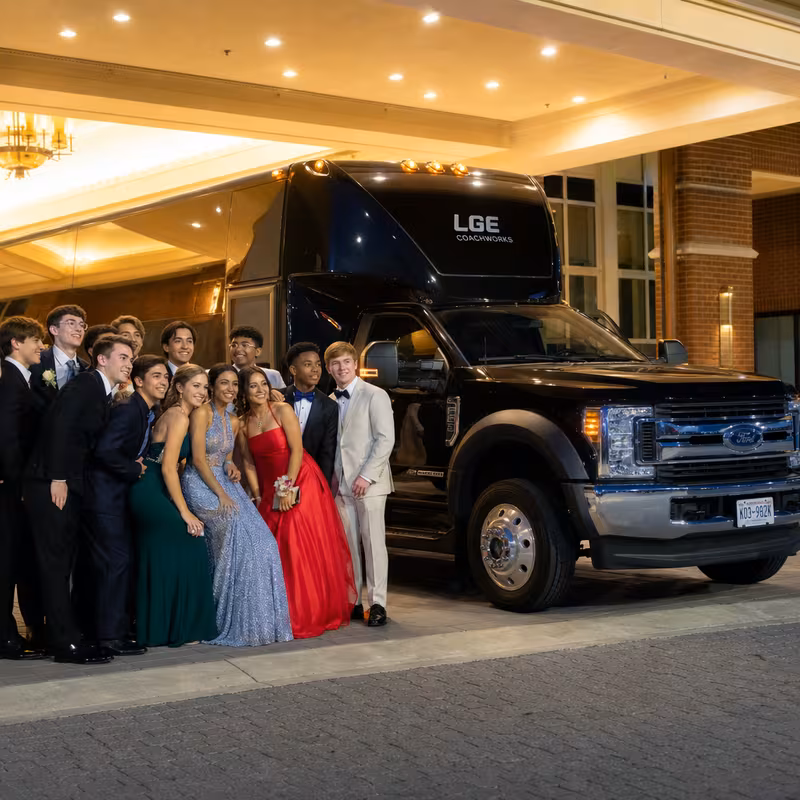 Party bus interior with wraparound leather seating and LED lighting in Birmingham